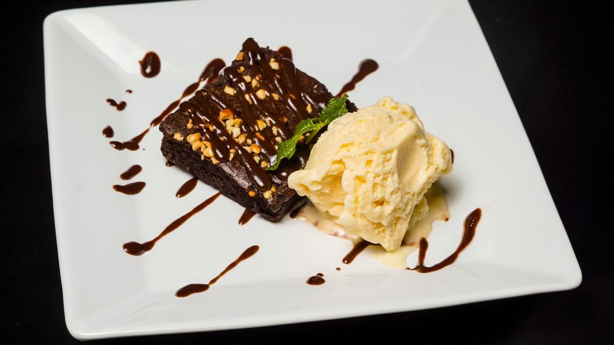 Chocolate dessert with vanilla ice cream and chocolate sauce